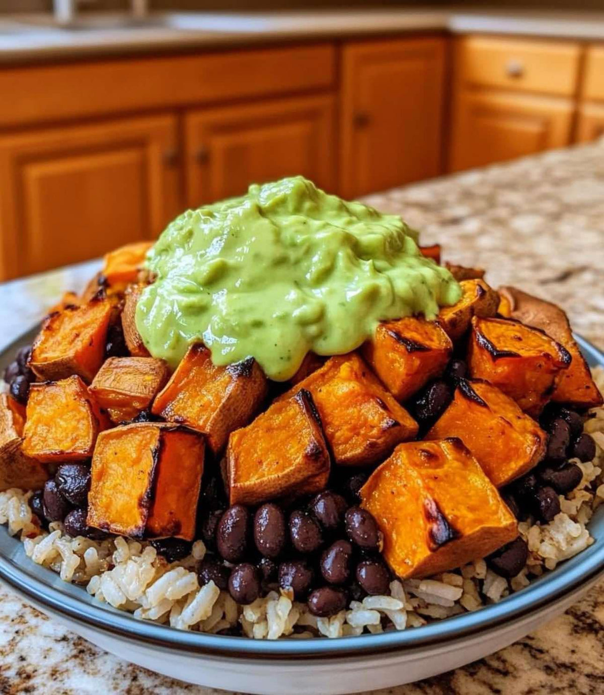 A sweet potato and black bean bowl with avocado